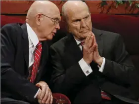  ?? AP PHOTO/RICK BOWMER ?? In this Sept. 30, file photo, Dallin H. Oaks (left) and Russell M. Nelson, members of a top governing body called the Quorum of the Twelve Apostles of The Church of Jesus Christ of Latter-day Saints, talk during the two-day Mormon church conference in...