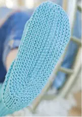  ??  ?? Bouncy garter stitch creates a ‘cushioned’ fabric that’s perfect for the slippers’ soles.