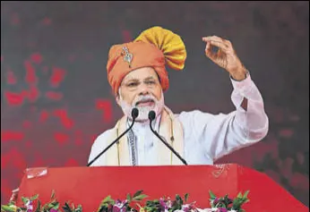  ?? PTI ?? Prime Minister Narendra Modi addresses a public meeting in Anand, Gujarat, on Sunday.