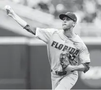  ?? Photos by Nati Harnik / Associated Press ?? Florida pitcher Jackson Kowar, a first-round draft pick by the Royals, struck out 13 Longhorns in 6 2⁄3 innings on Tuesday.