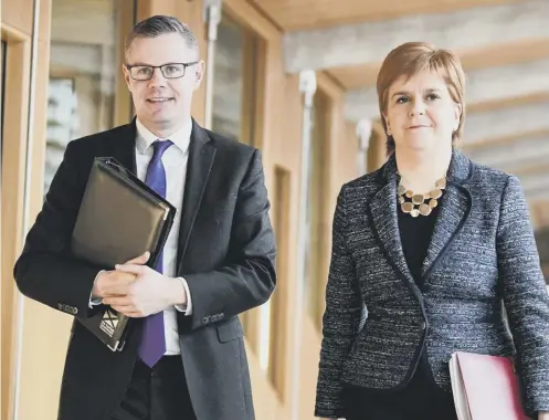  ?? ?? Derek Mackay pictured with Nicola Sturgeon at the Scottish Parliament in February 2018