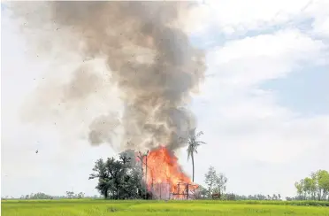  ?? AFP ?? A house burns in Gawdu Zara village near Maungdaw in Myanmar’s Rakhine state yesterday.