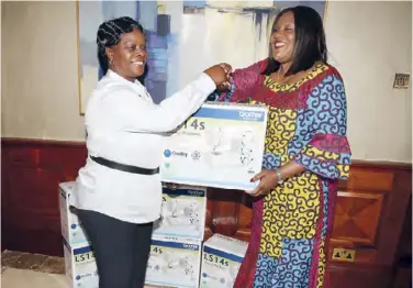  ??  ?? First Lady Esther Lungu receiving sewing machines