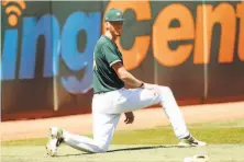  ?? Scott Strazzante / The Chronicle ?? A.J. Puk showed up at A’s camp 10 pounds lighter. Some of that weight loss came from his first haircut since 2016.