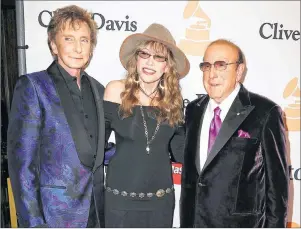  ?? AP PHOTO ?? In this February 2016 file photo, Barry Manilow, from left, Carly Simon and Clive Davis arrive at the Clive Davis Pre-Grammy Gala in Beverly Hills, Calif. Davis’ gala, which is held a day before the Grammy Awards, launched the careers of Whitney...