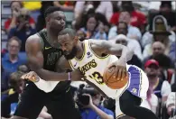  ?? (AP/Gerald Herbert) ?? LeBron James (right) and the Los Angeles Lakers will face Zion Williamson (left) and the New Orleans Pelicans tonight with the seventh seed in the NBA Playoffs on the line. The Lakers beat the Pelicans 124-108 on Sunday to knock them out of the sixth seed and into the play-ins, which both teams have played in twice before.