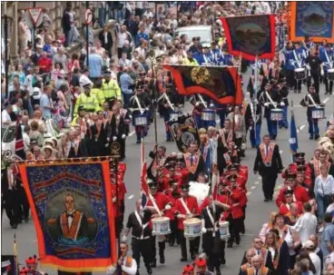  ??  ?? Orange Lodges parade through Glasgow city centre