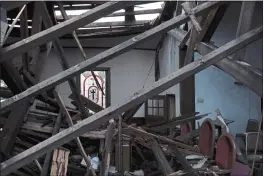  ?? AUDREY JACKSON — THE ASSOCIATED PRESS ?? Debris fills the sanctuary of the St. James African Methodist Episcopal Church in Mayfield, Ky., after a tornado last month collapsed the auditorium roof and northernfa­cing wall.