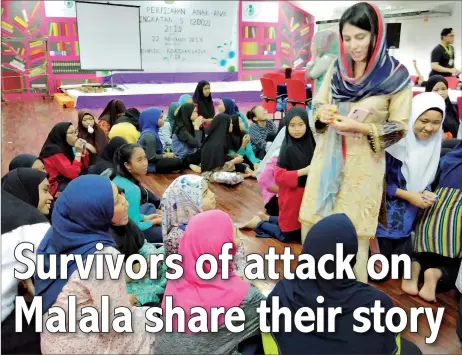  ??  ?? Shazia interacts with the children of Laila Taib Orphanage Complex.