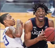  ?? Kathy Willens / Associated Press ?? UConn’s Isaiah Whaley controls the ball at Seton Hall during a March 3 game. Whaley will return for a fifth season, the school announced Tuesday.