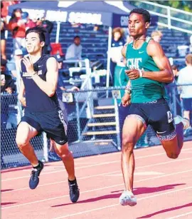  ?? Craig Weston ?? JADEN RATTAY of Lincoln, left, challenged Dijon Stanley of Granada Hills in the City 400 final but came in second. Stanley ran 46.94 to Rattay’s 48.15.