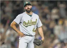  ?? Stephen Brashear / Associated Press ?? A’s relief pitcher Chris Hatcher allowed a game-tying solo home run to Seattle Mariners' Mike Zunino in the eighth.