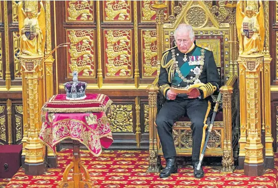  ?? ?? POMP AND DIFFICULT CIRCUMSTAN­CE: Prince Charles filled in at the Queen’s Speech but lacked the gravitas of his mother.