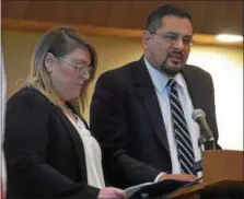  ?? PETE BANNAN – DIGITAL FIRST MEDIA ?? Ashley Coyle, of the Crime Victims’ Center of Chester County Inc. and Barraza Esquire, Chester County Deputy District Attorney read the names of victims of homicide at the memorial service at Central Presbyteri­an Church.