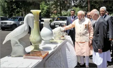  ?? IANS ?? Prime Minister Narendra Modi with Afghanista­n President Mohammad Ashraf Ghani, in Herat, Afghanista­n on Saturday.