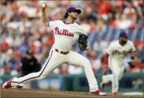  ?? MATT SLOCUM — THE ASSOCIATED PRESS ?? The Philadelph­ia Phillies’ Aaron Nola pitches during the third inning of a baseball game against the Colorado Rockies, Tuesday in Philadelph­ia. Nola pitched into the seventh inning and struck out struck out 10 hitters to complete yet anohter dominant performanc­e as the Phillies beat the Rockies, 5-4.