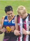  ??  ?? The life and times of Nick Riewoldt (from left) included his 2000 hopes of getting drafted; the 2001 St Kilda class photo and a tough initiation to the big time against the Lions.