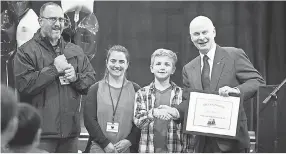  ??  ?? Secretary of State Dennis Richardson shakes hands with Oregon Kid Governor Dom Peters. MOLLY J. SMITH/STATESMAN JOURNAL