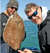  ??  ?? Something’s missing – Andy Pilott (left) caught this ‘tailless’ beauty pushing 3lb