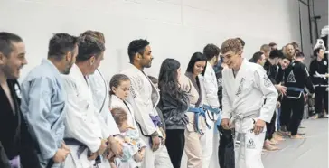  ?? Photos by Josh Golds Photograph­y ?? Jiu-jitsu students line up ahead of a demonstrat­ion