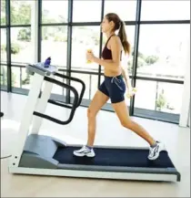  ?? PHOTOS.COM ?? Tired of your treadmill? Add some weights to change up your routine.