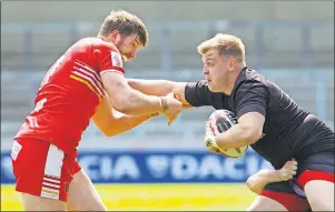  ?? CP PHOTO ?? Toronto Wolfpack forward Jack Bussey, right, carries the ball during rugby action against the Salford Red Devils in Salford, England on Sunday April 23. Bussey underwent surgery May 12 in his English hometown of Leeds to remove a lump in his thyroid....