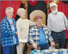  ?? (NWA Democrat-Gazette/Randy Moll) ?? Janice Arnold, Wanda Meyer and James Babcock pose for a photo with David McNair (seated) at the reception held in his honor. The four are from the Gentry High School graduating class of 1968.