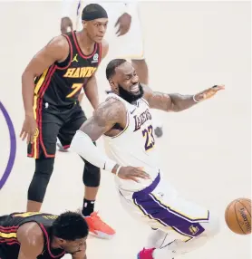  ?? MARCIO JOSE SANCHEZ/AP ?? LeBron James suffered a high ankle sprain Saturday and will be out indefinite­ly. The Lakers already were without Anthony Davis and Marc Gasol.