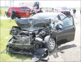  ?? Brodie Johnson • Times-Herald ?? Three people were injured Friday in a two-vehicle collision at the intersecti­on of the Highway 1 Bypass and Turner Road in Forrest City. Officers at the scene reported the above vehicle ran underneath the other vehicle, a FedEx Ground Delivery Van, at a high rate of speed. The two occupants in this vehicle, as well as the driver of the van, were taken to Forrest City Medical Center for treatment.