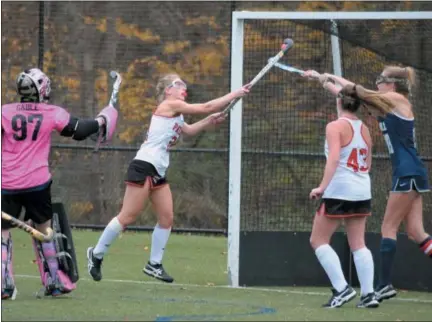  ?? GENE WALSH — DIGITAL FIRST MEDIA ?? Germantown Academy’s Sophie Towne reaches up to knock the ball into the net during their PAISAA semifinal against The Hill School Wednesday.