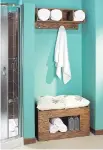  ??  ?? This bathroom towel storage unit is a weekend project that efficientl­y uses the space in this small nook.