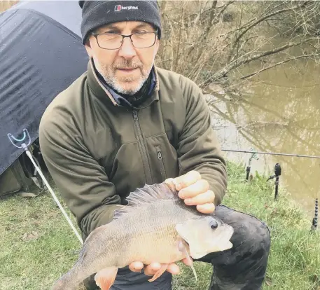  ??  ?? Sussex angler Colin Smithson with a prize perch – Colin also happens to be current British barbel record holder