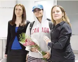  ??  ?? HOME – Rahaf Mohammed Alqunun smiles broadly as she is presented to media accompanie­d by Canadian Foreign Minister Christie Freeland (right) after arriving in Toronto, Canada where she was granted an asylum. (AP)