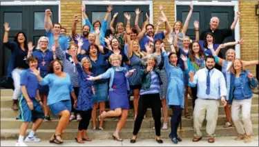  ?? PHOTO COURTESY OF HOLY FAMILY SCHOOL ?? Faculty and staff at Holy Family School literally jumped for joy after hearing the news the school had been named a National Blue Ribbon School.