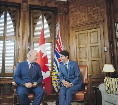  ?? SEAN KILPATRICK / THE CANADIAN PRESS ?? B.C. Premier John Horgan’s decision not to discuss the Trans Mountain pipeline following his meeting with Prime Minister Justin Trudeau in Ottawa on Tuesday hints at a growing reluctance to fight the project, writes John Ivison.