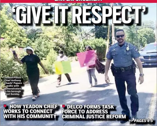  ?? KATHLEEN E. CAREY - MEDIANEWS GROUP ?? Yeadon Police Chief Anthony ‘Chachi’ Paparo
walks with demonstrat­ors in his borough last Sunday.