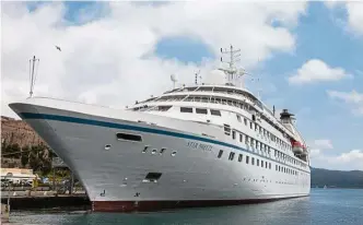  ??  ?? Windstar’s newly-acquired and refitted yacht, the Star Breeze, lies dock-side at Portoferra­io, island of Elba.