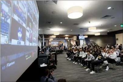  ?? ?? The CU women’s team watches the screen waiting for their NCAA Tournament selection during a watch party at the Touchdown Club in Boulder on Sunday.