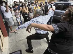  ?? MOISES CASTILLO AP ?? Fabio Rodolfo Vasquez and his wife, Maria Moreno, dance at a promotiona­l event outside a coffee shop on the outskirts of Guatemala City. The couple met in a Guatemala City club more than 30 years ago when they won a dance contest.