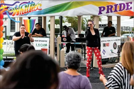  ?? PHOTO BY KEITH DURFLINGER ?? Betsy Boys, right, performs as Tanya Winterton, left, signs during the first Whittier Pride Festival at Central Park in Whittier in September 2019.