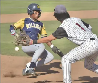  ?? Dan Watson/ The Signal ?? Millikan High baserunner Cameron Hegamin (22) beats the tag by Hart third baseman Casey Hinojosa (1) in the seventh inning at Hart High recently.