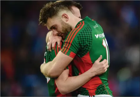  ??  ?? Aidan O’Shea consoles team-mate Cillian O’Connor after the All-Ireland Final replay defeat to Dublin at Croke Park in October.