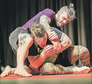  ?? PHOTO COURTESY OF MARTIN BLAIS/AGGRO PHOTOGRAPH­Y ?? Gavin Tucker battles with Kent Peters in a Brazilian jiu-jitsu match in January 2015 at the Glasgow Square in New Glasgow, N.S.