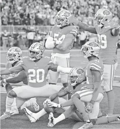  ?? CARY EDMONDSON/USA TODAY SPORTS ?? Cornerback Richard Sherman (25) and the 49ers celebrate an intercepti­on in the third quarter Saturday against the Vikings.