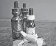  ?? NIKKI SULLIVAN/CAPE BRETON POST ?? CBD oil comes in many forms but the most common way recommende­d to take it is orally or topically for skin conditions. In this picture are some tinctures and a couple of CBD caramels. CBD oil is legal in Canada and said to relieve chronic pain,...