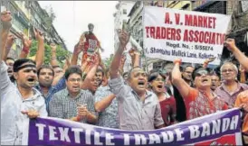  ?? PTI ?? Textile traders in Kolkata stage a demonstrat­ion against GST on Thursday.