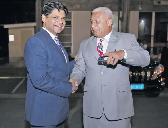  ?? Photo: DEPTFO News ?? Attorney-General and Minister for Economy Aiyaz Sayed-Khaiyum and Prime Minister Voreqe Bainimaram­a outside Parliament after the 2018-2019 National Budget announceme­nt on June 28, 2018.