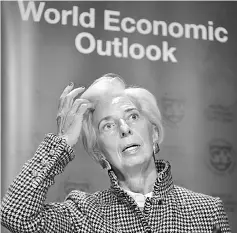  ??  ?? Internatio­nal Monetary Fund (IMF) Managing Director Christine Lagarde attends a press conference on IMF World Economic Outlook ahead of the World Economic Forum (WEF) 2018 annual meeting, on January 22 in Davos, eastern Switzerlan­d. — AFP photo