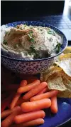  ?? Tribune News Service ?? ■ Hummus, a creamy Middle Eastern dip made with chickpeas and tahini paste, is perfect for mindless dipping.