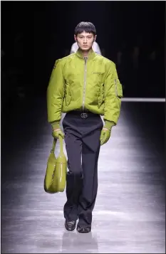  ?? PHOTOS FROM GUCCI VIA THE NEW YORK TIMES ?? A model walks the runway at the Gucci collection menswear show during the Milan Fashion Week.